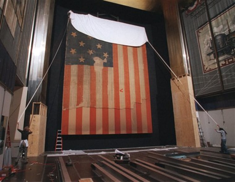 The flag that inspired the Star Spangled Banner is prepared for restoration in this 1998 photo. The grant program that helped with the restoration is on the current administration's chopping block. 